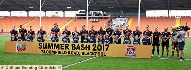 OLDHAM players stand for a minute's silence in honour of the Manchester bomb victims

