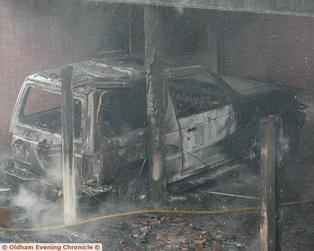 A burned out car was amongst the wreckage.