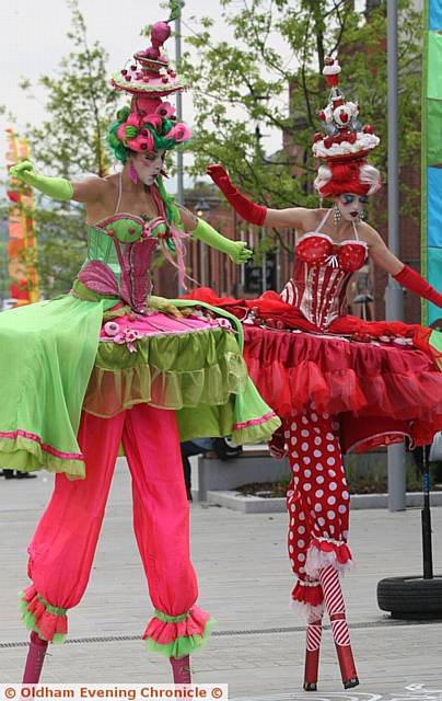 THE  Cake Ladies totter on their stilts