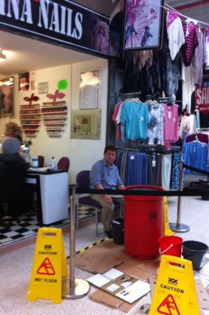 BUCKETS and a bin collect the drips outside Cinas Nails to the despair of owner Chuoi Tran