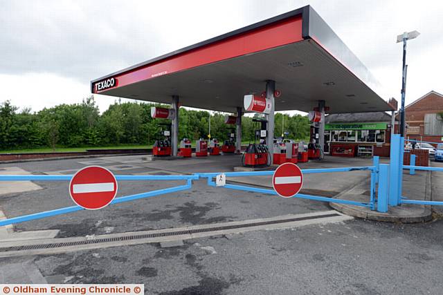 SCENE of robbery . . . Police at the Co-Op filling station at Lees