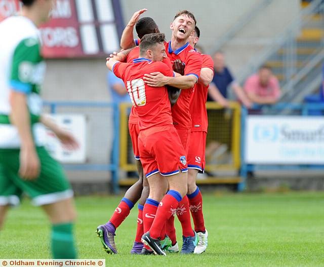 SMILEY FACES . . . Athletic players celebrate Ousmane Fane's goal.