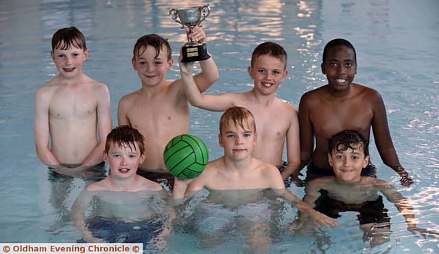 BIG SMILES . . . the victorious team from Hodge Clough show off their silverware