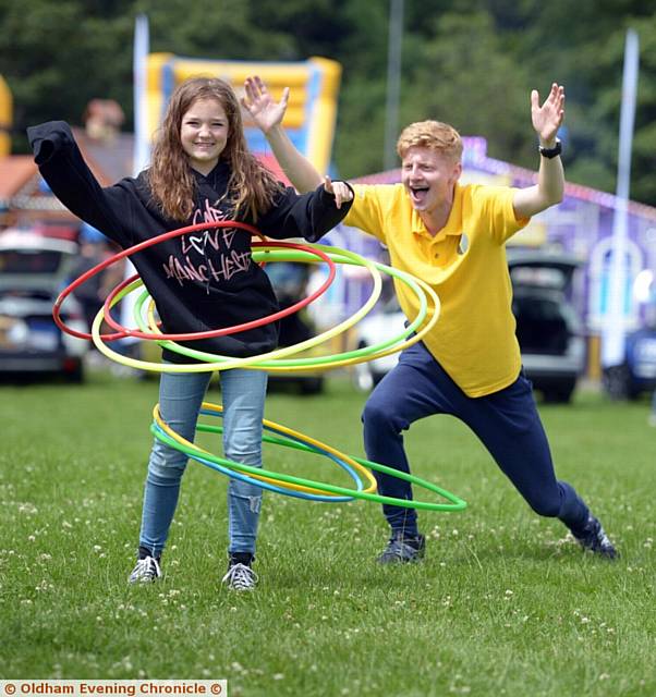 HOOPS of fun . . . Isabelle Cartridge (10) tries out the hoola hoops at Mahdlo stand 