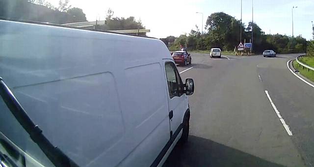 The Ford Transit van is seen moving into the path of the lorry.