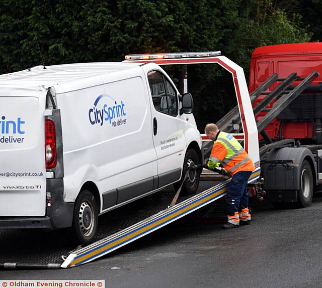 RECOVERY . . . a van is taken away