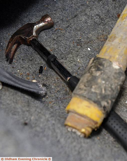 Asif Lohdi had his car stolen. When it was recovered he found tools/ weapons strewn around the vehicle. Police still haven't been out to see it.  PIC shows hammer and pick axe handle.
