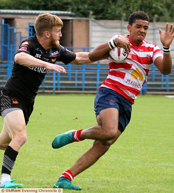 OLDHAM FLYER . . . Kameron Pearce-Paul (right) tries to dart past a Bradford opponent