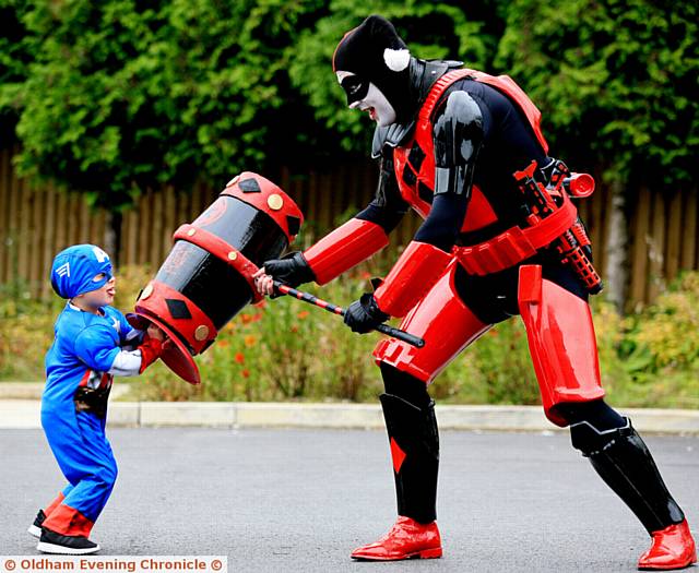 BATTLE . . . Charlie Wild (4) as Captain America takes on Adam Hunt as the Harley Trooper