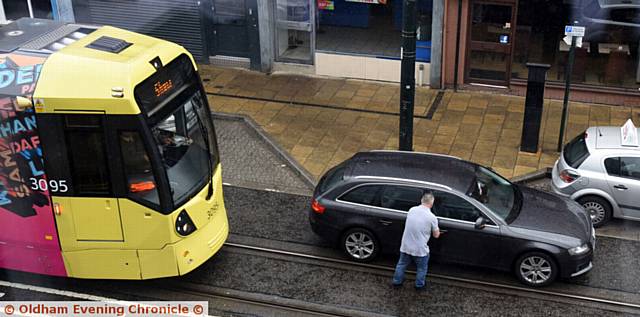 Driver parked on tram tracks on Union Street, Oldham.