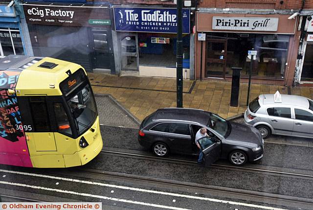 Driver parked on tram tracks on Union Street, Oldham.