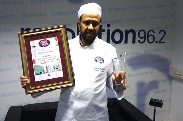 Mohammed Miah shows off his awards