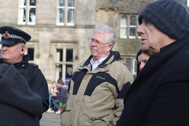 Pictured are Saddleworth District Executive Members with local police in Uppermill centre.