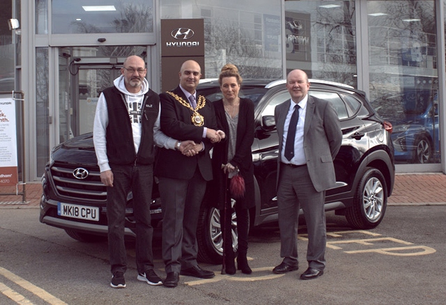 Mr and Mrs Clutterbuck - pictured with the Mayor of Oldham Cllr Shadab Qumer - collected their Hyundai from Paul Sharp (right), the Holdcroft centre principal.