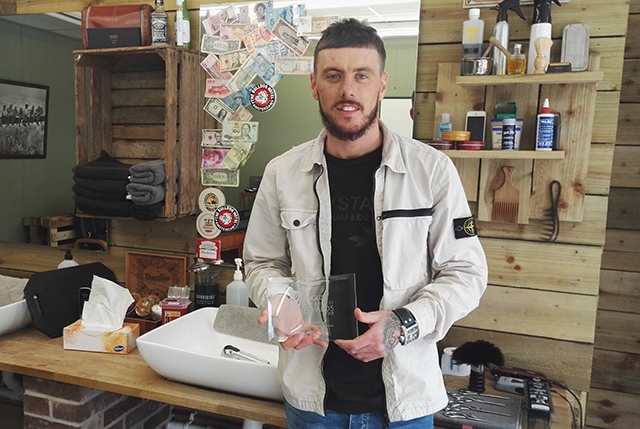 Darren O'Neill shows off his prize from the English Hair and Beauty Awards