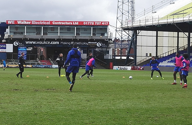 Action from one of the small-sided practise games as Athletic manager Richie Wellens (furthest left) watches on