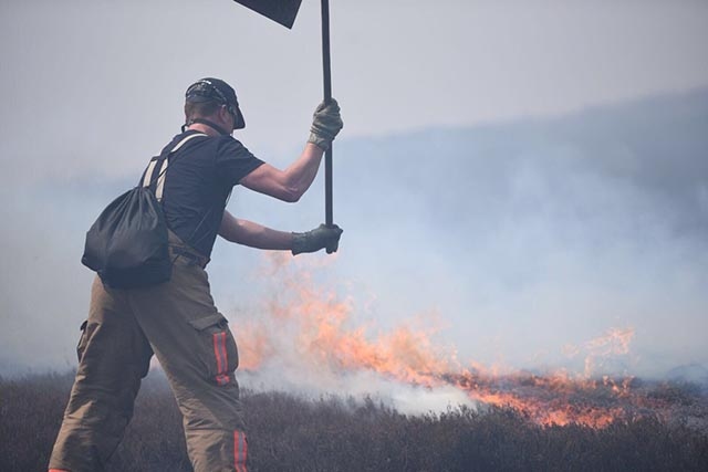 A firefighter tackles the devastating scenes on Saddleworth Moor yesterday.

Picture courtesy of @manchesterfire on Twitter