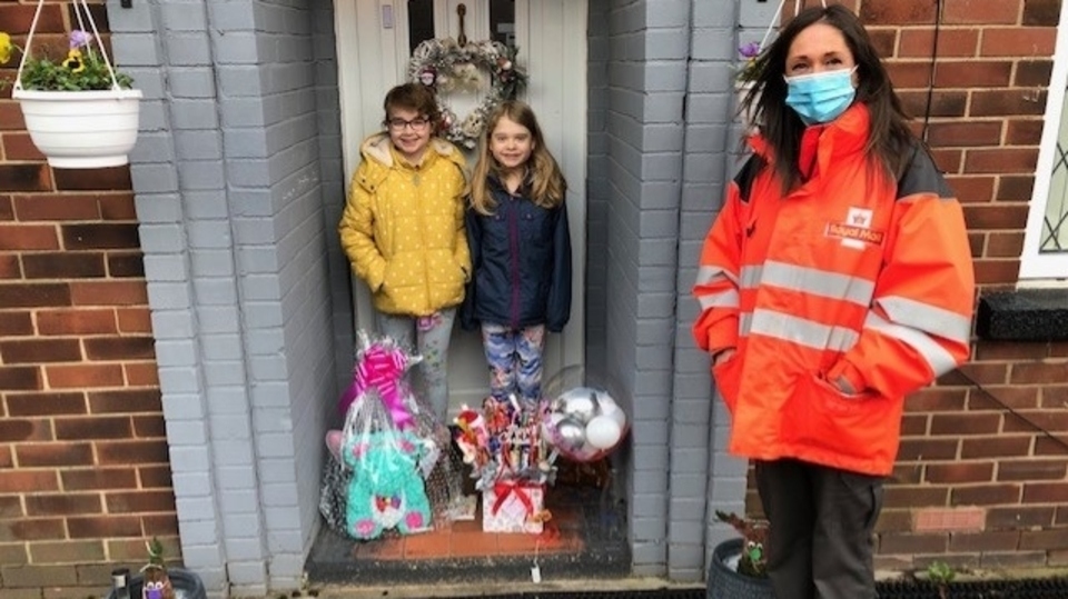 Laraine from Royal Mail in Oldham makes her special delivery to Abigail and her sister Annabel