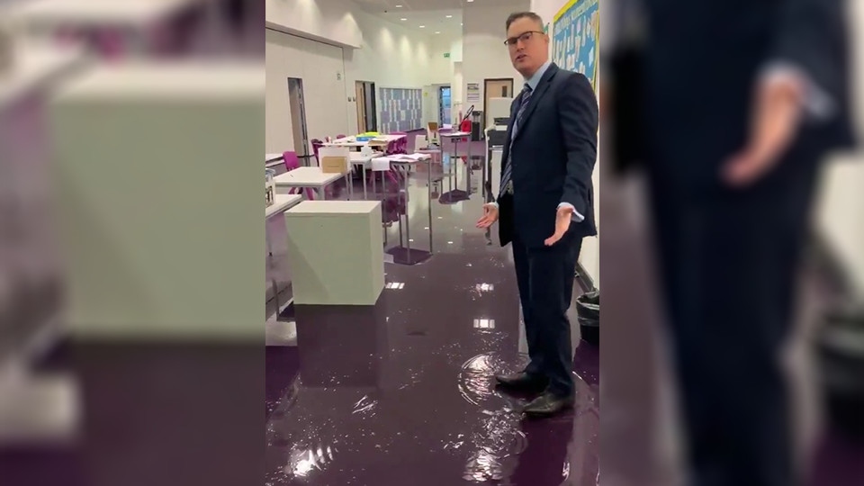 A video update posted on Twitter by the headteacher showed Mr Potts standing in a classroom flooded with around two inches of water.