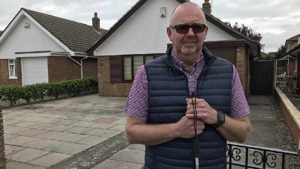 Pictured is Senior Rehab Officer Simon Merrills, who has been writing guides for blind and visually impaired people to help them with social distancing