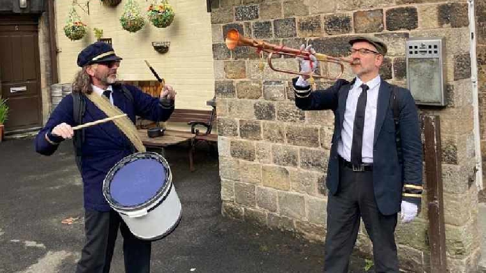 Simon Hodgson and Paul Ellison are pictured outside Delph Band Club