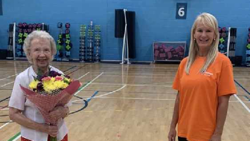 Violet Walpole is pictured with her birthday bunch of flowers