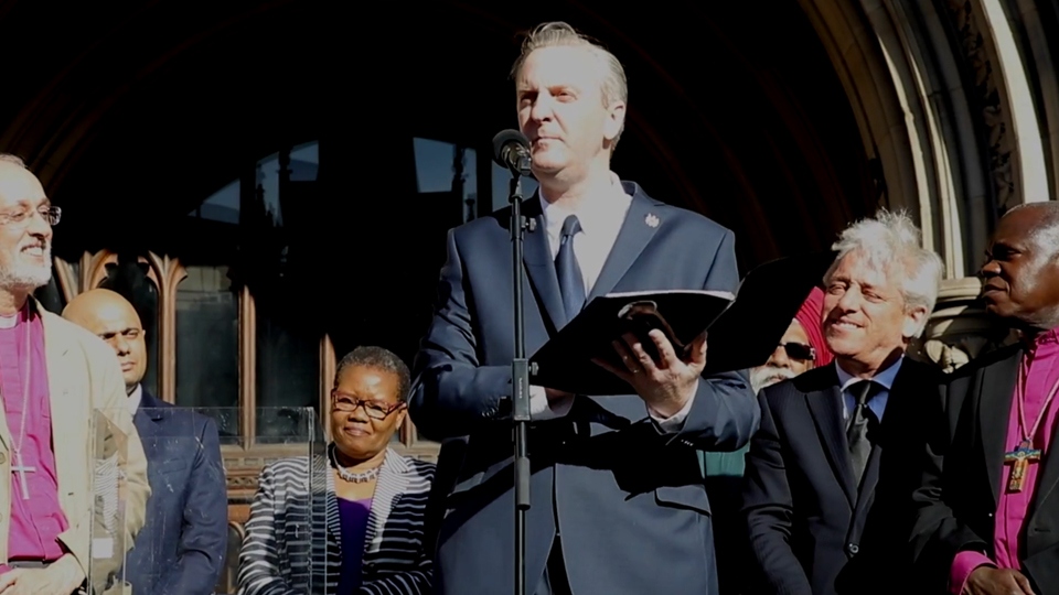 Tony Walsh speaking at the public vigil following the bomb attack at the Manchester Arena.