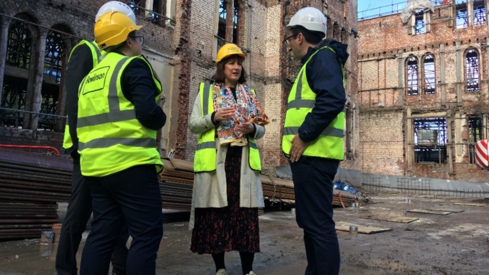 Shadow chancellor Rachel Reeves at Ancoats Dispensary in Manchester with council leader Bev Craig and mayor Andy Burnham