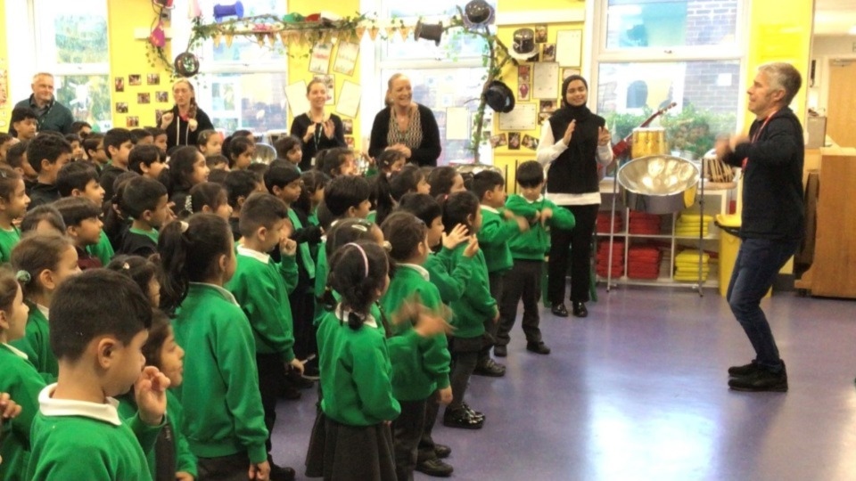 Poet Andy Tooze pictured with the Greenacres Primary Academy children