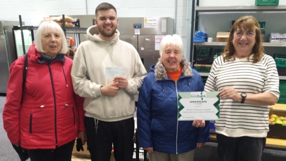 Pictured are Rosanne, Joan, Tom Lewis-Hood, Project Manager, and Pam Bailey, a SACG member and foodbank helper