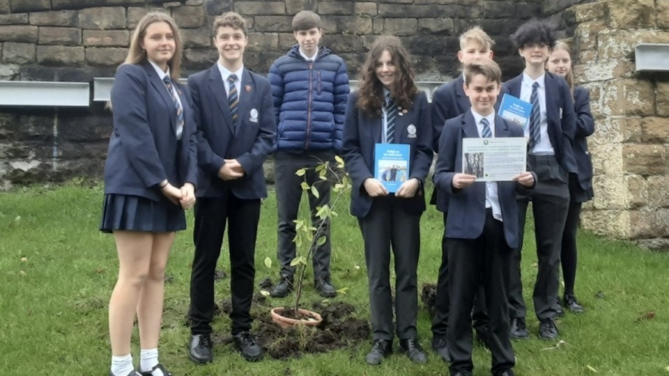 Year 10 students at the poignant tree-planting ceremony