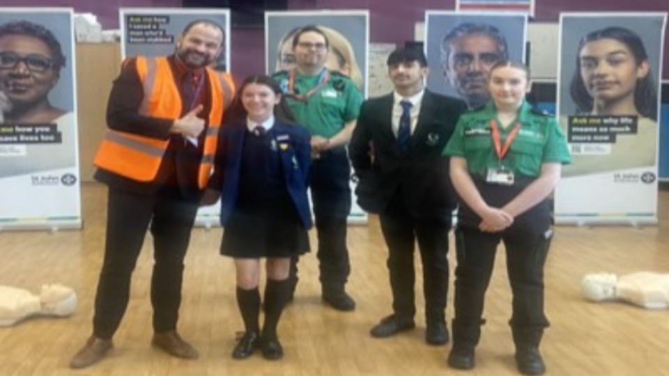 Pictured are: Vice Principal Lee Haughton congratulating Mally (Y8 Waterhead Academy Student) on becoming the 15,000th person in Greater Manchester to be trained as part of the ‘Three Ways to Save a life' campaign, along with Shannon (Y11 student and St John Ambulance Facilitator) and Hamza (Year 11 Prefect) who helped to plan the training event