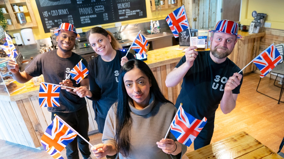 Cllr Arooj Shah, Leader of Oldham Council, preparing for the Jubilee with staff from Soul Cafe in Yorkshire Street