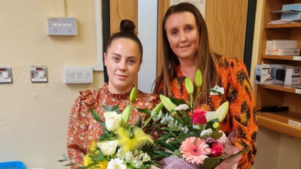 Pictured are life-savers Helen Cooke and Bethany Siddle with their bouquets of appreciation