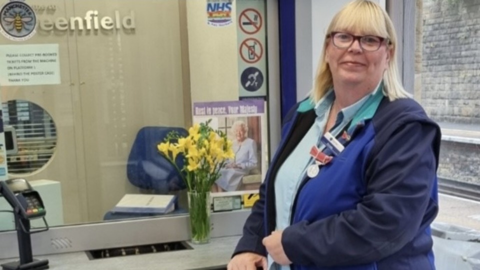 Richelle Walsh wears her treasured medal at work for the day