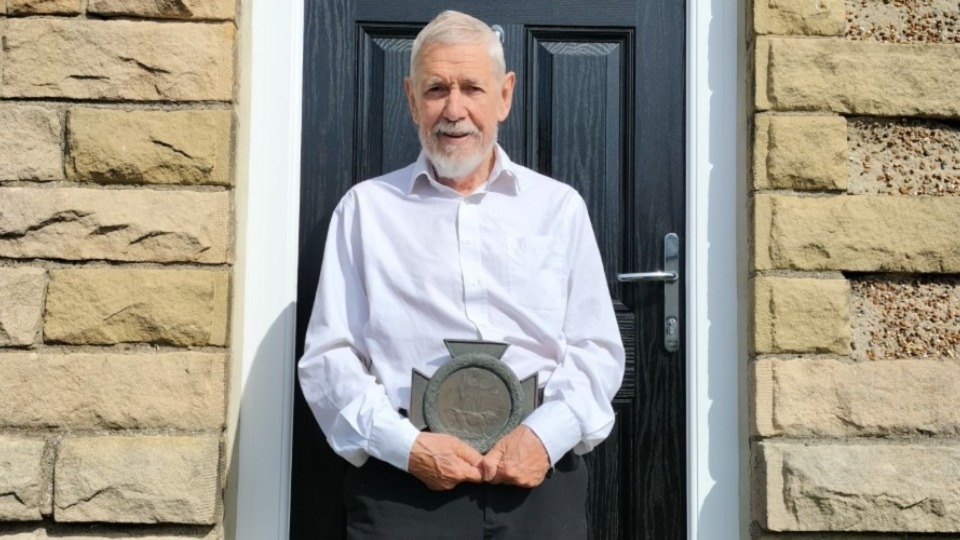 Proud Chris Foote-Wood is pictured with the WW1 memorial for Frank Wood given to his family