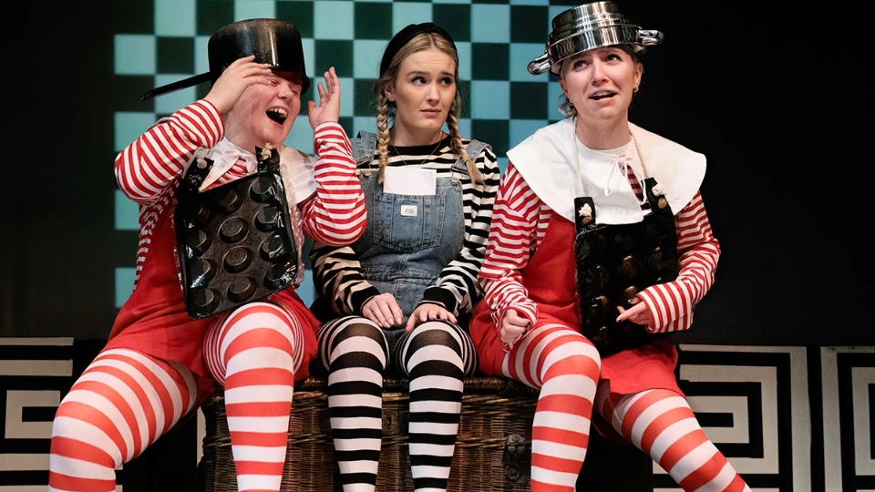 Kira Richardson (centre) takes the role of Alice in Laura Wade's new take on an old classic