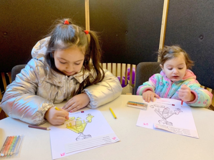 Nella Piroskova and Michaela Minarikova enjoying their colouring at NatWest's Oldham branch. 