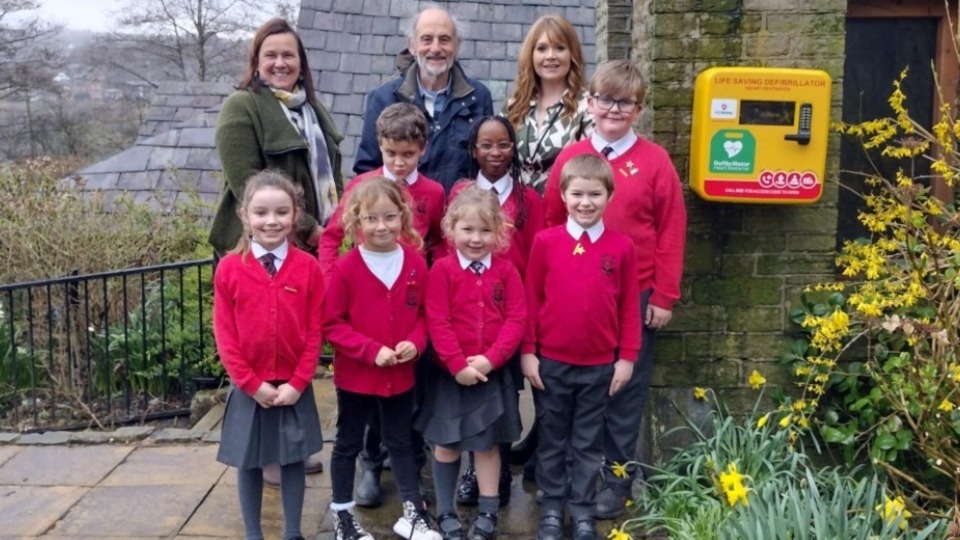 Pictured (left to right) are: Councillor Alicia Marland, Dr Ian Brett and Miss Butterworth alongside pupils from St Agnes School council