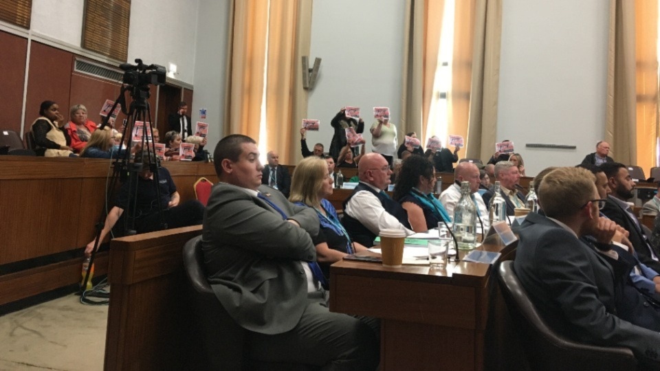 Protesters in the public gallery at Oldham full council last night