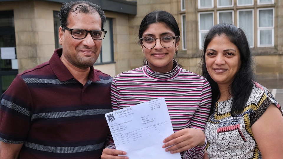 Jiya Dhoot is pictured with her parents