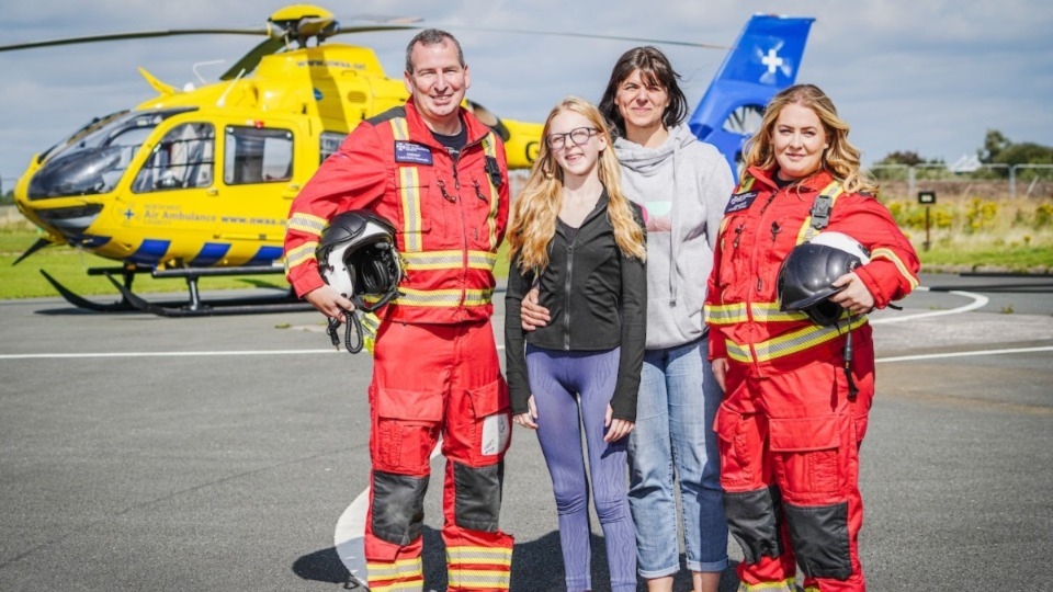 North West Air Ambulance Charity medical crew member Andrew, with Ruby, her mum Sinead, and North West Air Ambulance Charity emergency consultant doctor Eimhear