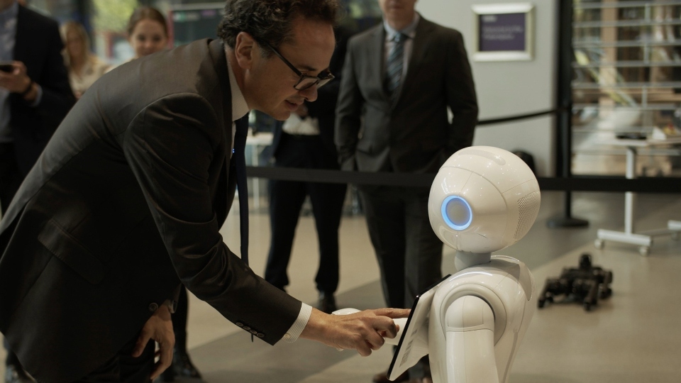 Viscount Camrose, Minister for AI and Intellectual Property, meets humanoid robot Pepper at the Manchester University Engineering Building. Images courtesy of DSIT