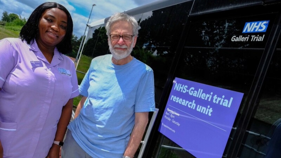 A volunteer taking part in the NHS Galleri trial with a member of staff