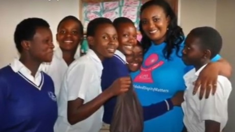 Kana Josee Bizimana (centre) responded to a cry for help from the continent of her birth in 2016