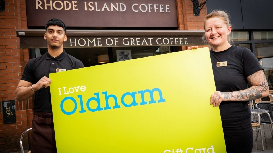 Staff at Rhode Island Coffee in Spindles Shopping Centre with the Oldham gift card