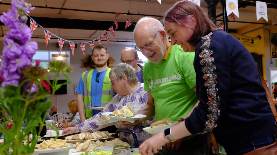 Emmaus Mossley trustees, volunteers and companions enjoying lunch together