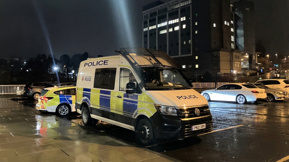 A riot van pictured outside last night's Oldham Council meeting