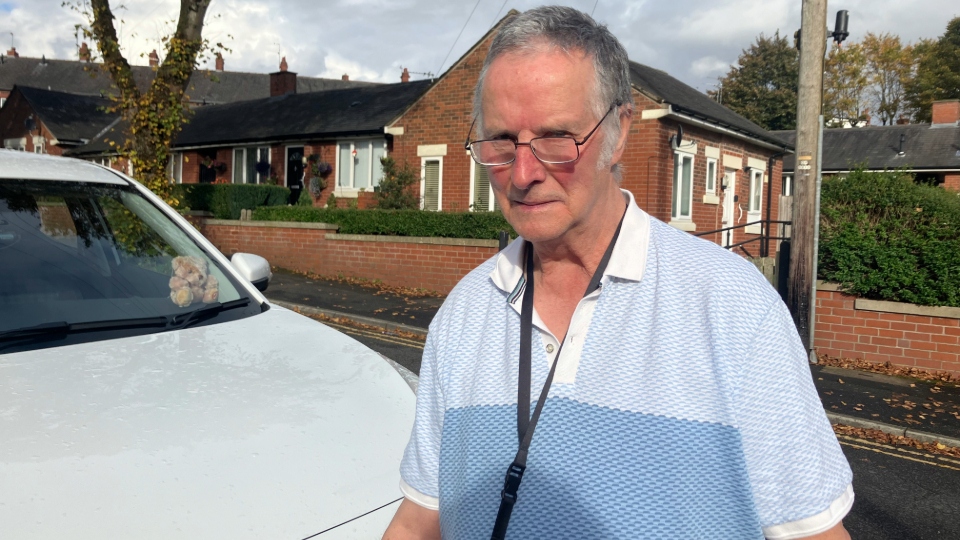 David Kelsall pictured next to his EV. Image courtesy of Charlotte Hall