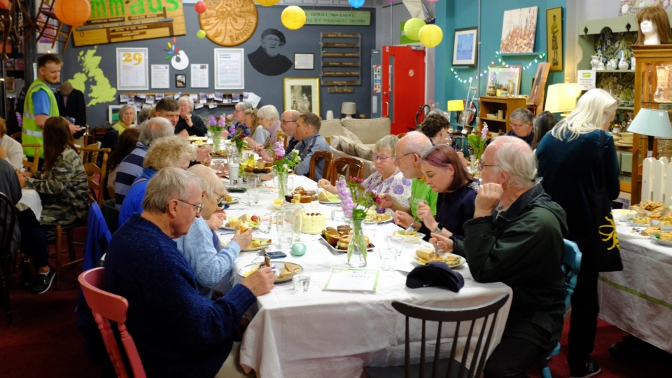 Guests eating together at the Emmaus Mossley Volunteers' Week Big Lunch